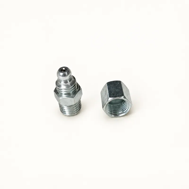 Inyector de grasa metálico alargado con cuerpo cilíndrico y conexiones · SKF LL/85497